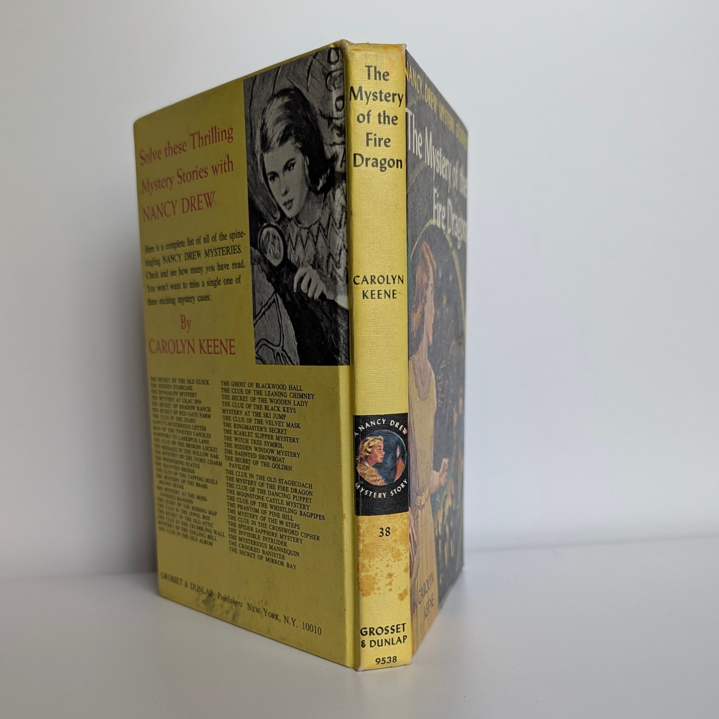 Vintage Nancy Drew The Mystery of the Fire Dragon book by Grosset & Dunlap with yellow spine and white endpages