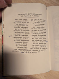 Vintage Hardy Boys book page showing list of mystery titles by Franklin W. Dixon, Grosset & Dunlap, Inc. edition