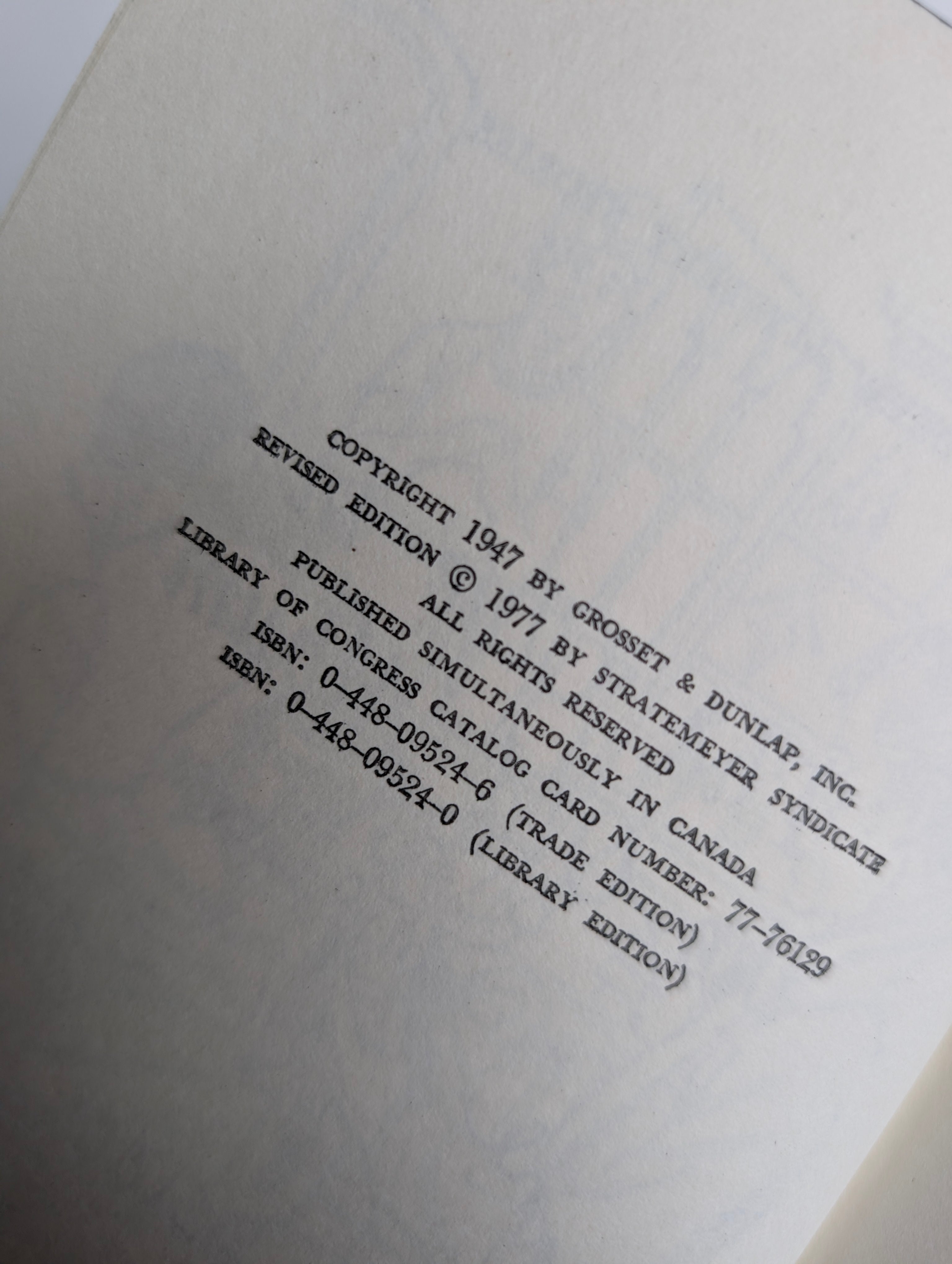 Copyright page of 1947 Grosset & Dunlap Nancy Drew Mystery book The Clue in the Old Album revised edition