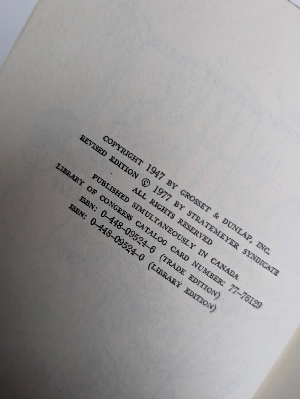 Copyright page of 1947 Grosset & Dunlap Nancy Drew Mystery book The Clue in the Old Album revised edition