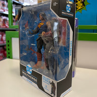McFarlane DC Multiverse 7-inch Superman Death Metal action figure in box with accessories side view