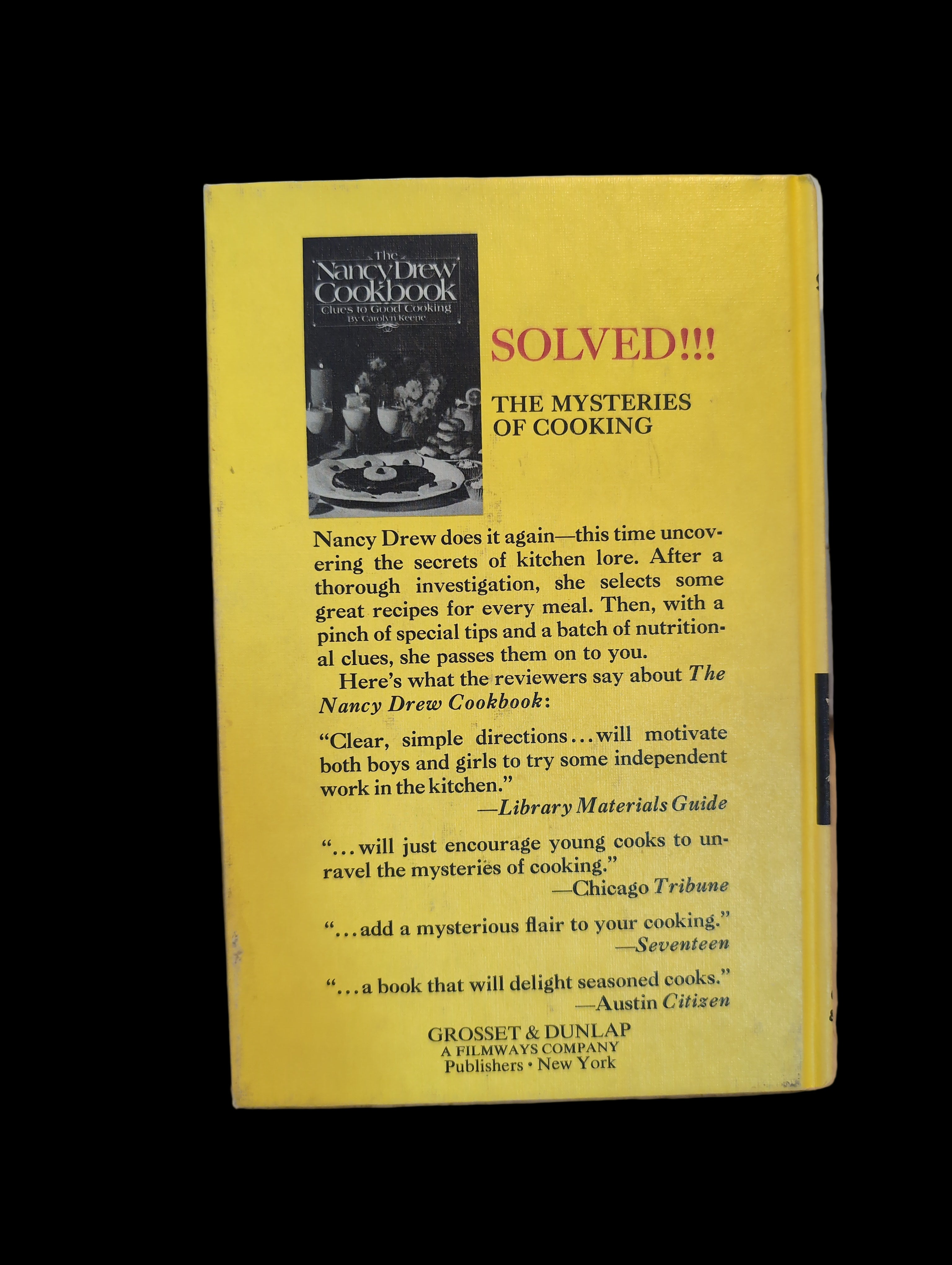 Back cover of The Nancy Drew Cookbook by Grosset & Dunlap, Inc. featuring cooking mysteries and reviews.