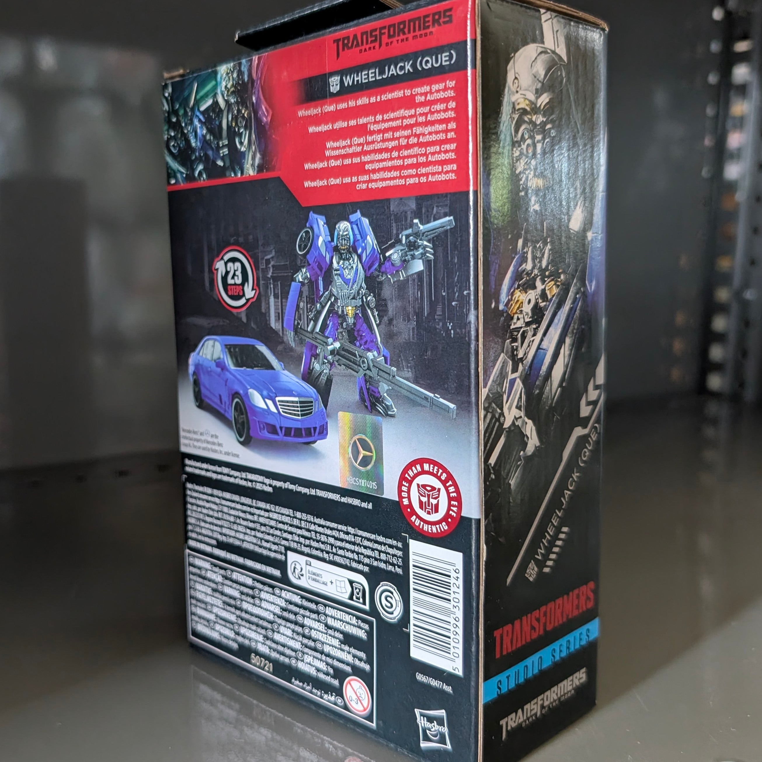 Packaging box showing Wheeljack Transformers:Dark of the Moon Studio Series Action Figure by Hasbro with vehicle and robot modes.