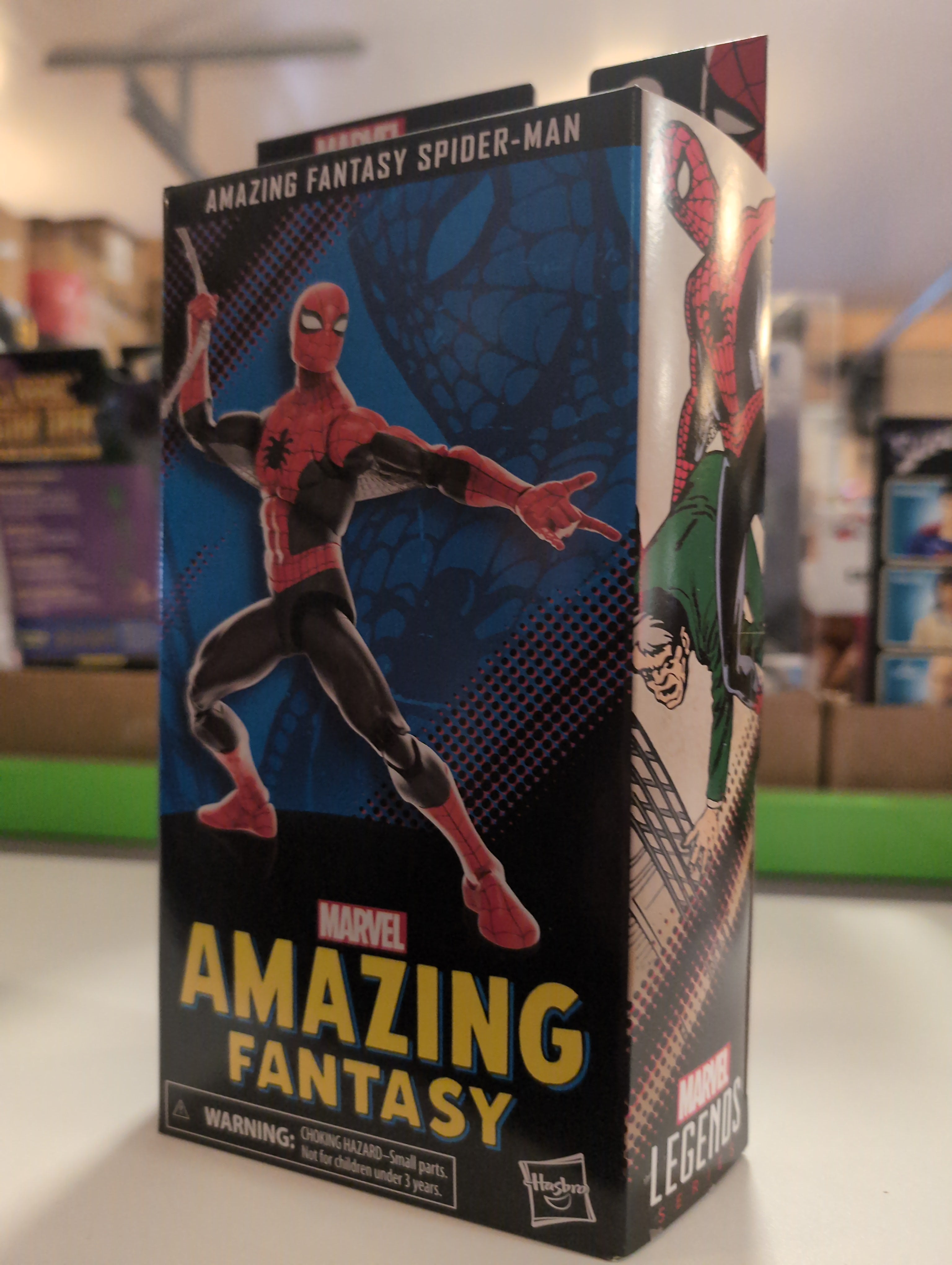 Marvel Legends Amazing Fantasy Spider-Man figure box featuring dynamic Spider-Man and villain artwork.