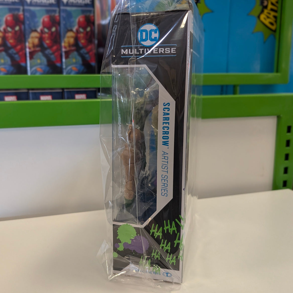 McFarlane DC Multiverse Scarecrow Jokerized Artist Series 7-inch scale action figure side view in packaging