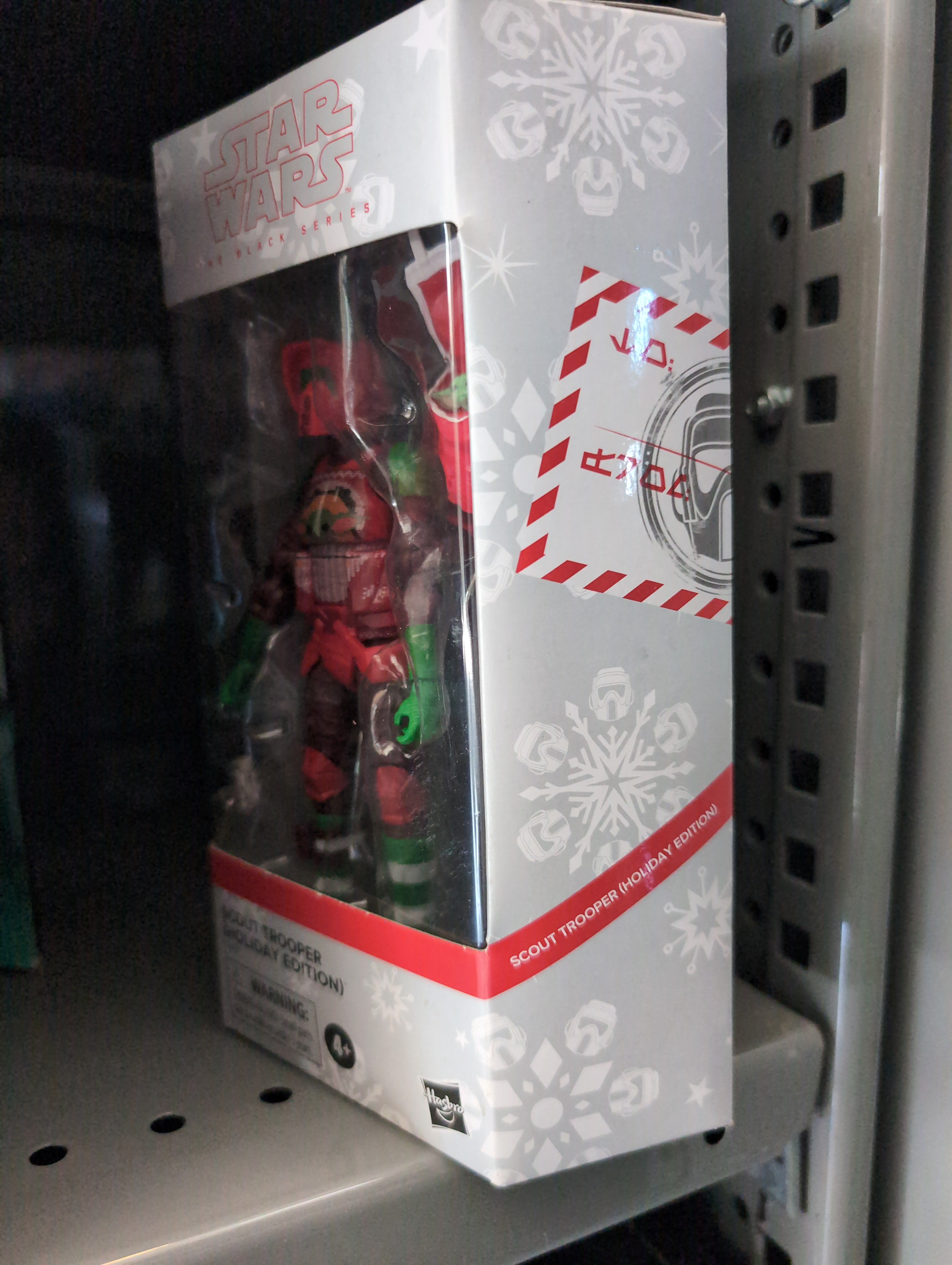 Hasbro Star Wars Black Series Christmas Biker Scout Trooper figure in festive armor with Santa hat in collector box