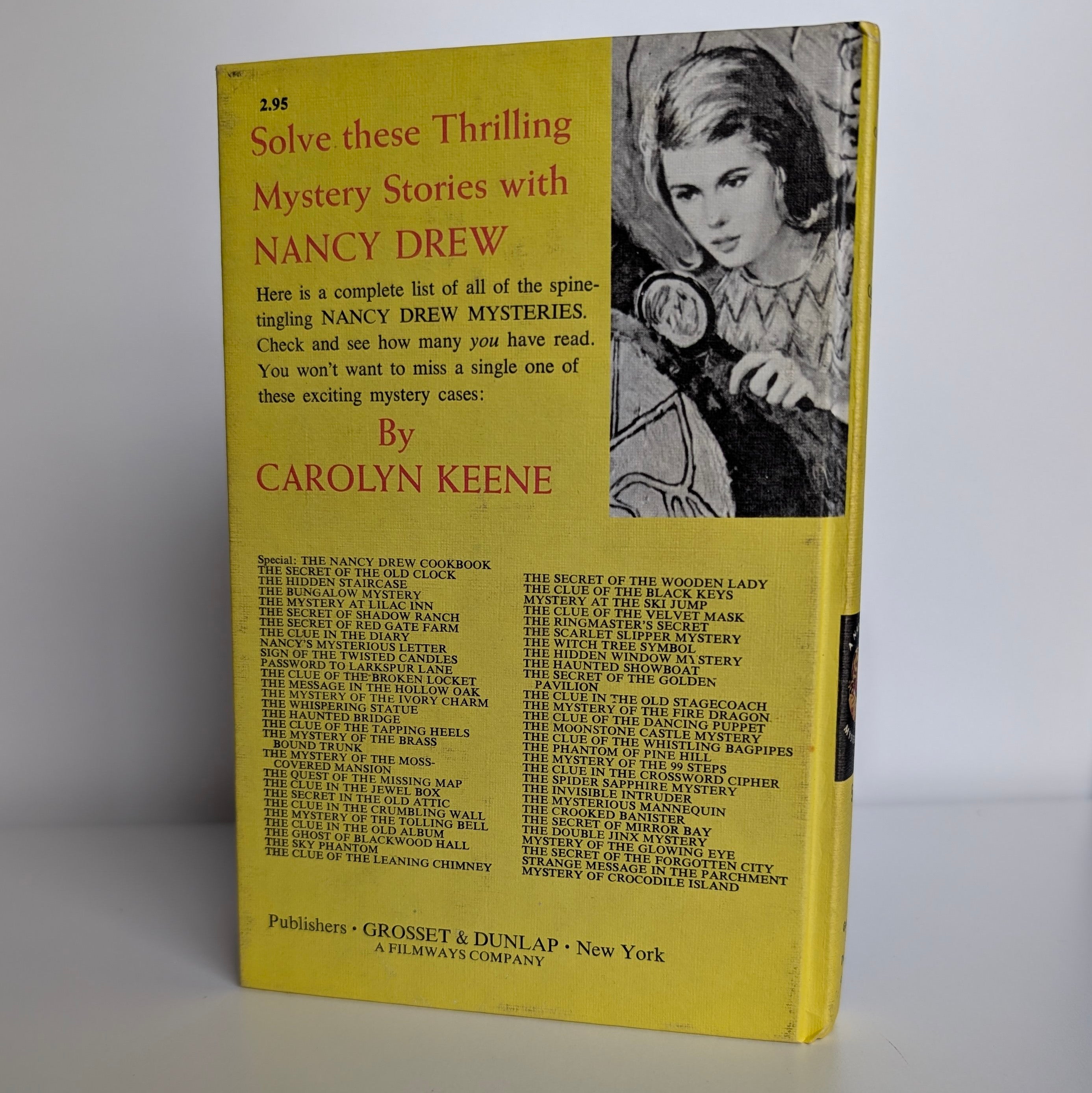 Back cover of 1978 Grosset & Dunlap Nancy Drew Mystery of Crocodile Island book with list of titles and illustration