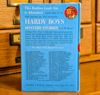 Back cover of Hardy Boys book 21 The Clue of the Broken Blade published by Grosset & Dunlap, Inc.
