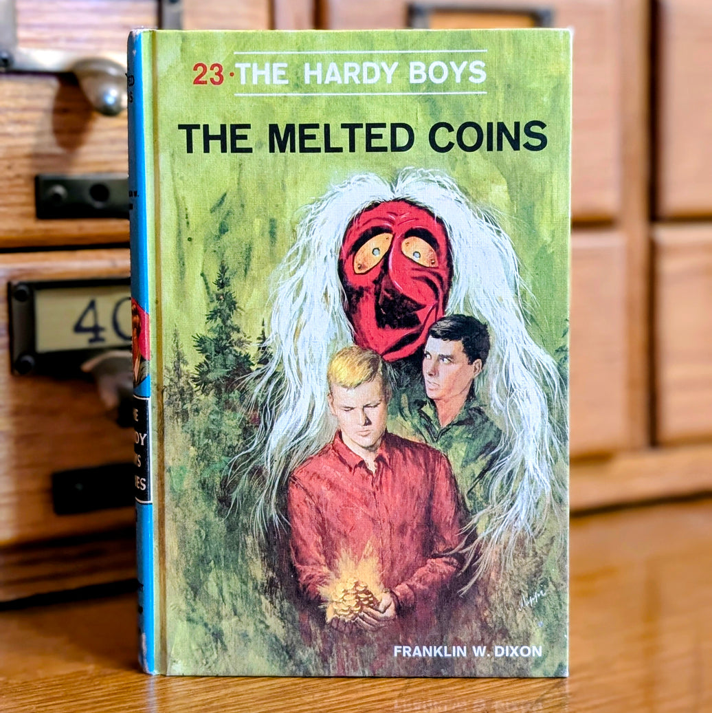 Vintage Hardy Boys book The Melted Coins from 1970 by Grosset & Dunlap Inc with red numbered cover design