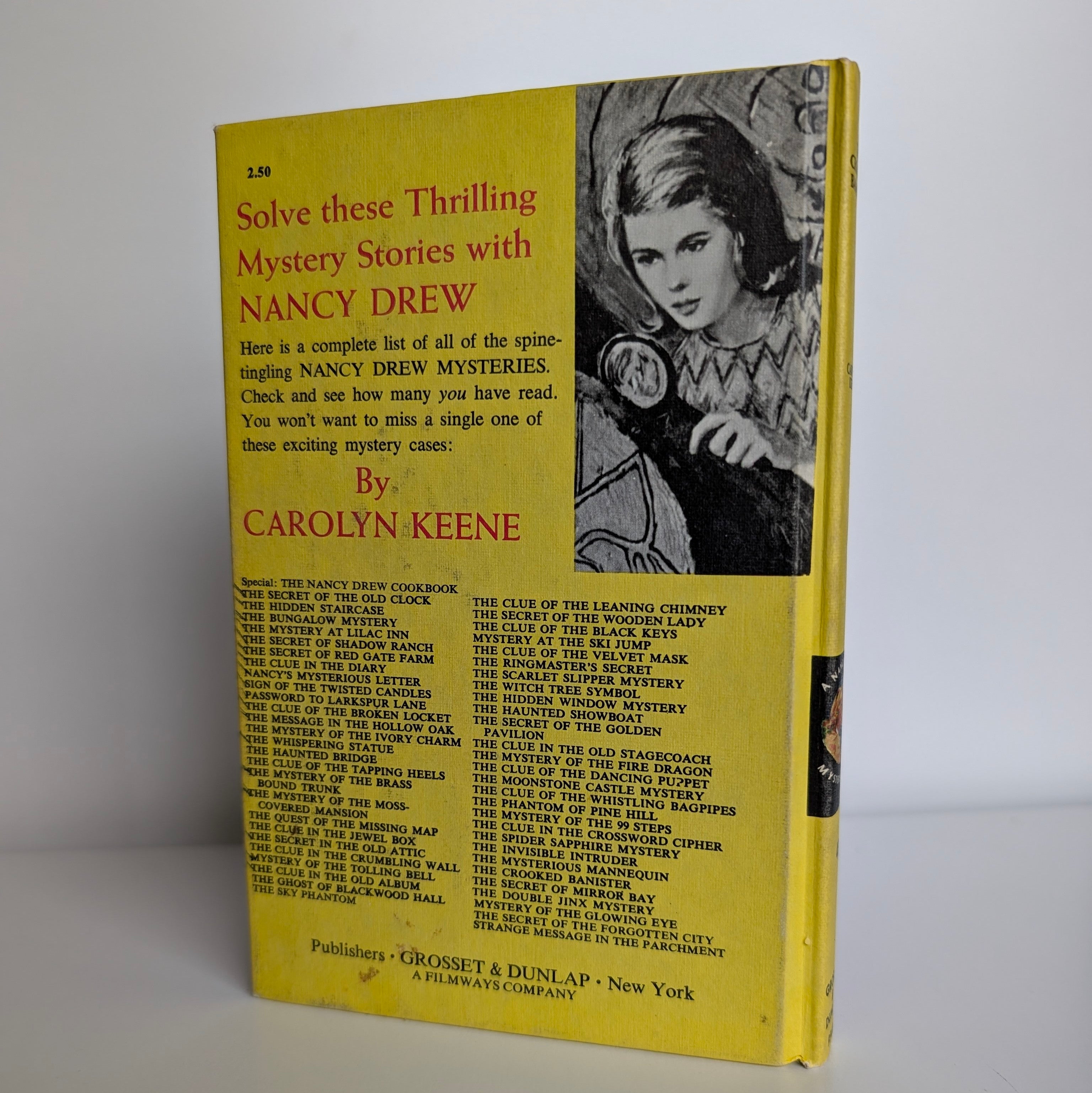 Vintage Nancy Drew The Crooked Banister mystery book back cover by Grosset & Dunlap 1971 edition