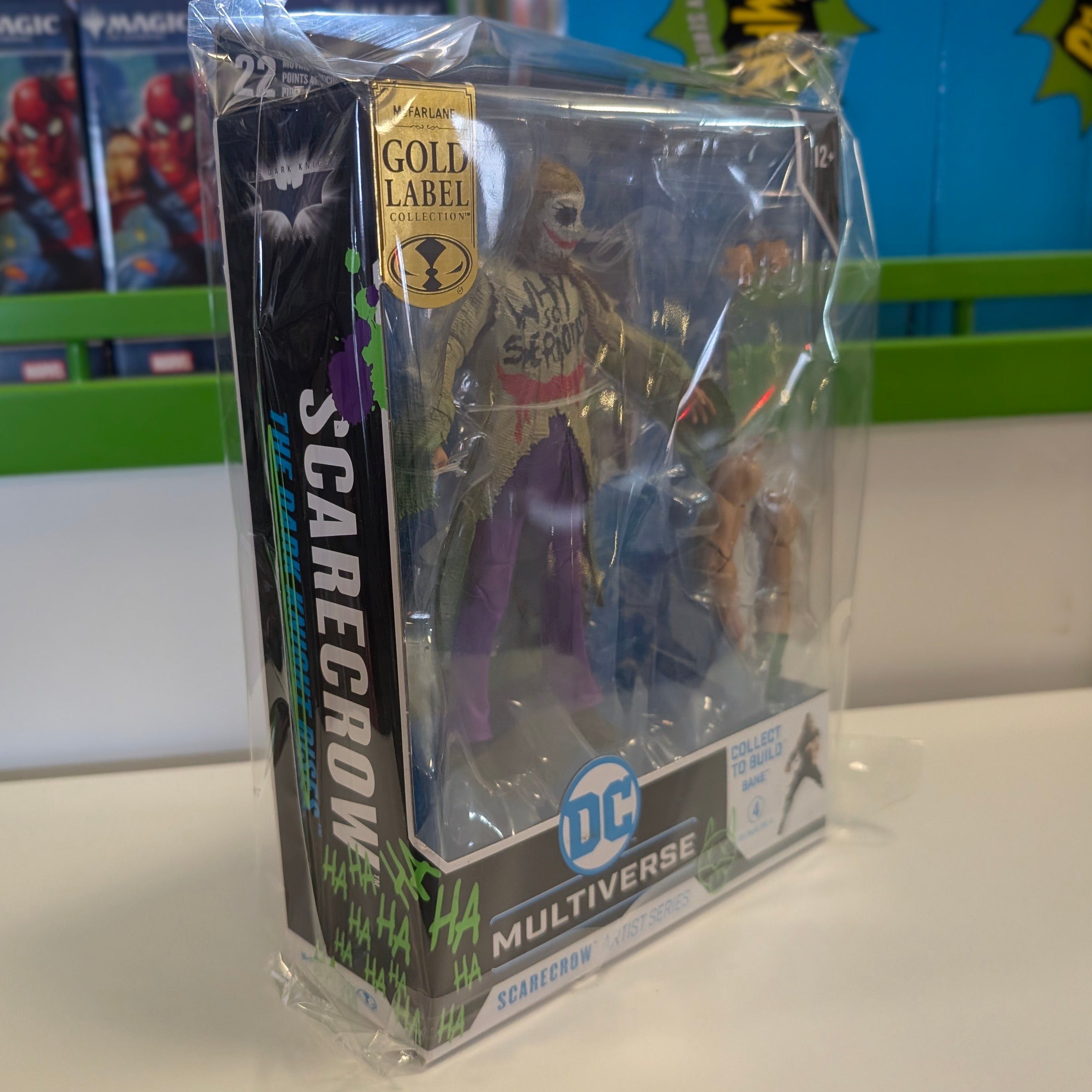McFarlane DC Multiverse 7-inch Scarecrow Jokerized action figure with detailed costume and accessories in packaging side view