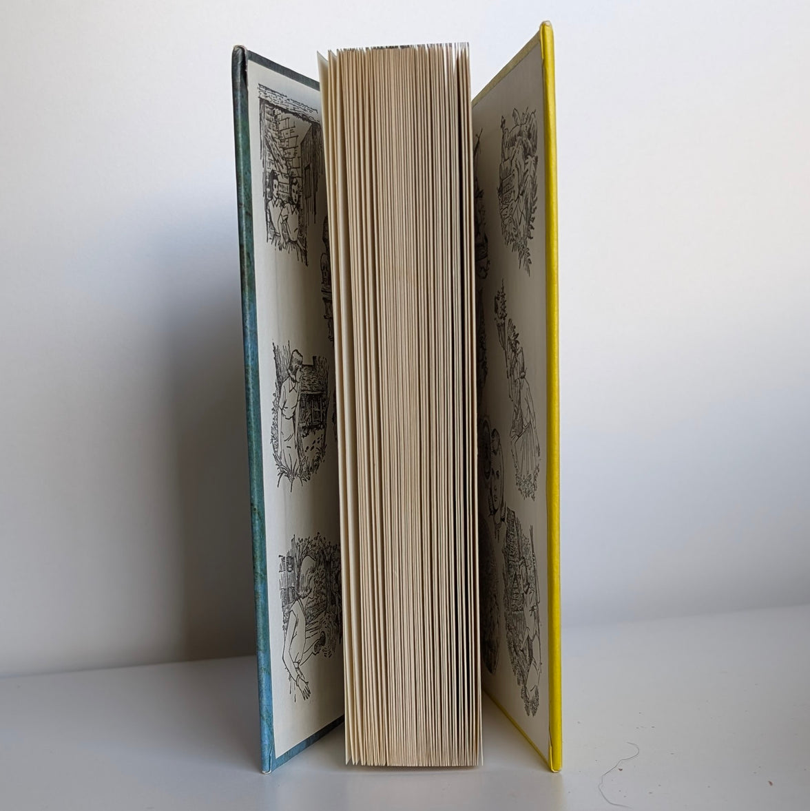 34 The Hidden Window Mystery Nancy Drew Book -1956/1975 (white-endpages) by Grosset & Dunlap, Inc., opened standing upright