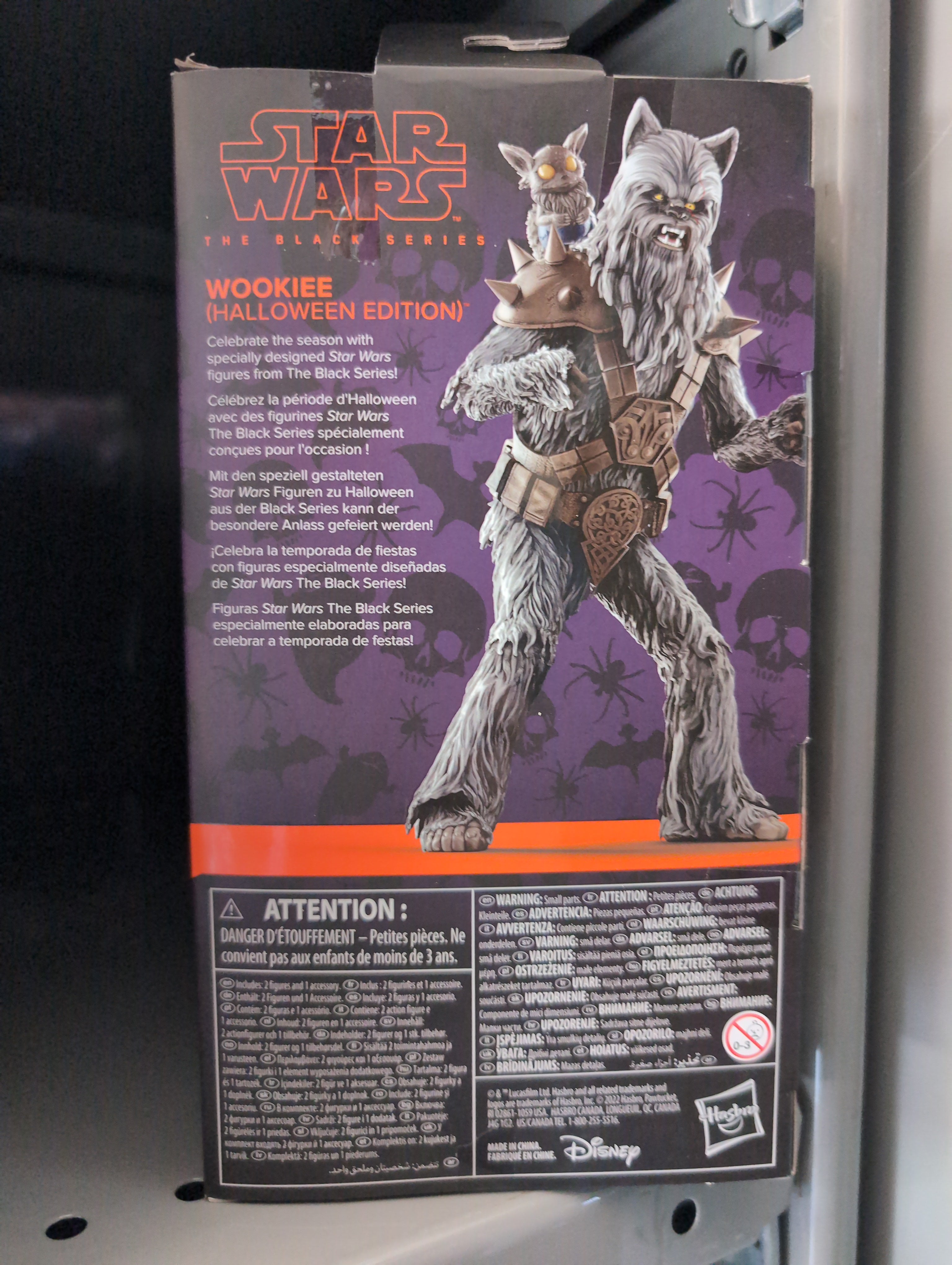Hasbro Star Wars Black Series Halloween Wookiee action figure with werewolf head sculpt and accessories on collector box.