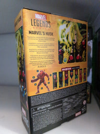 Hasbro Marvel Legends Husk action figure packaging showing character info and Build-A-Figure parts collection.