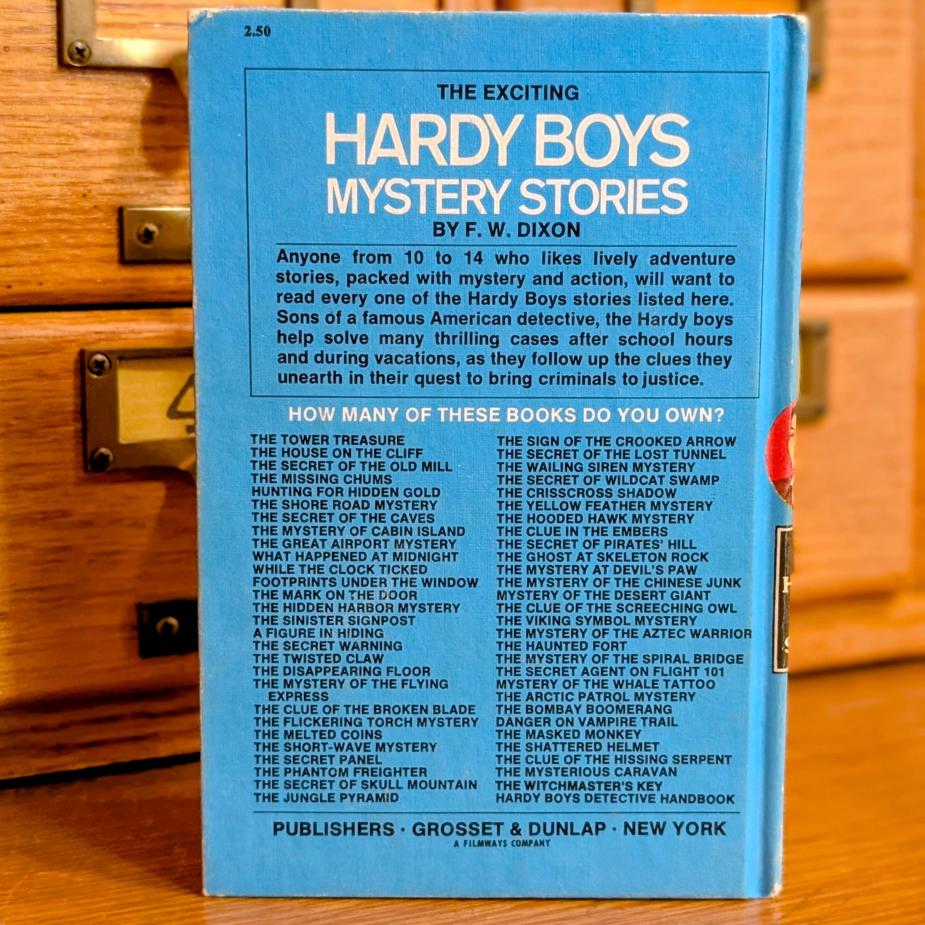 Back cover of Hardy Boys book 23 The Melted Coins 1970 edition published by Grosset Dunlap New York