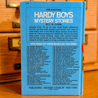 Back cover of Hardy Boys book 23 The Melted Coins 1970 edition published by Grosset Dunlap New York