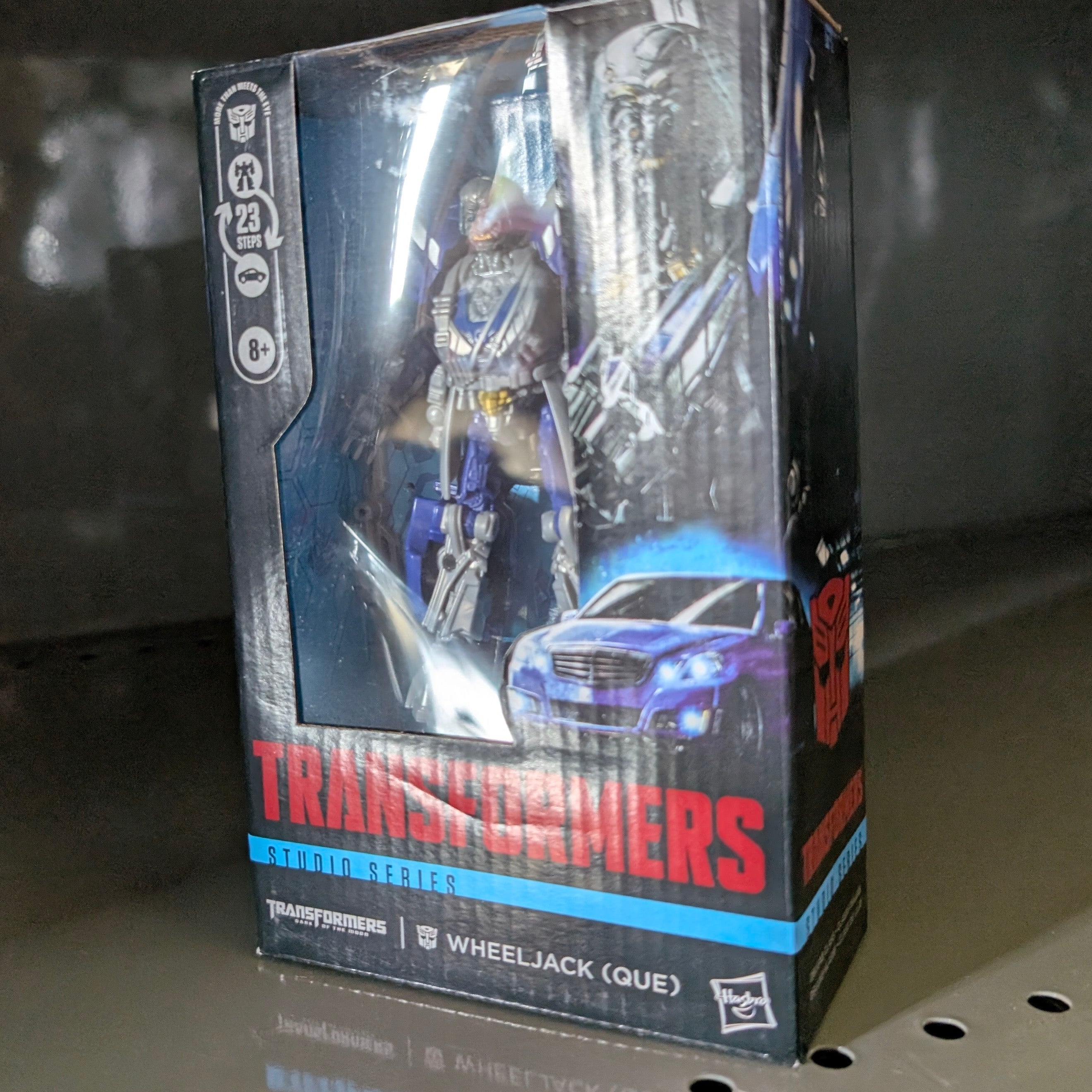 Wheeljack Transformers:Dark of the Moon Studio Series Action Figure by Hasbro in collectible packaging on display shelf