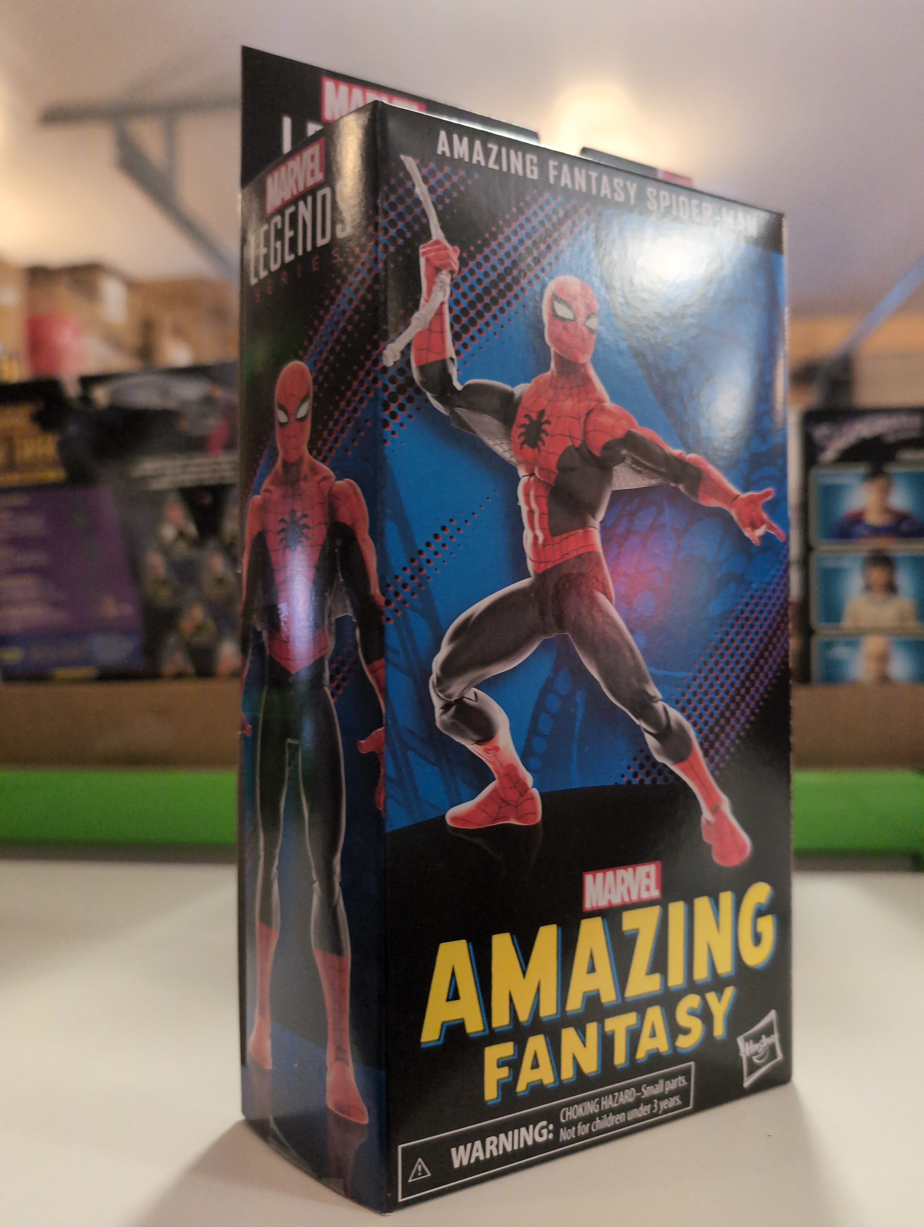 Marvel Legends Amazing Fantasy Spider-Man figure packaging showing Spider-Man in dynamic pose on a black and blue background.