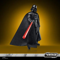 Darth Vader figure from The Vintage Collection with a red lightsaber on a yellow background