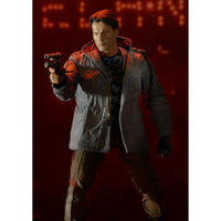 The Terminator T-800 Tech Noir Ultimate 7-Inch Scale Action Figure NECA posed with gun in dark jacket and pants on red background